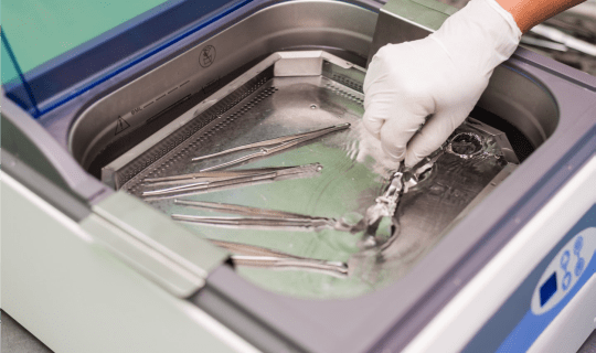 Veterinary surgical tools being cleaned