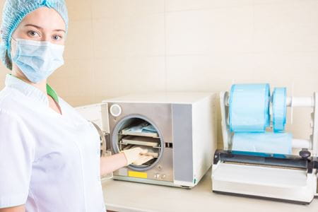 Surgical instrument sterilization machine and trays