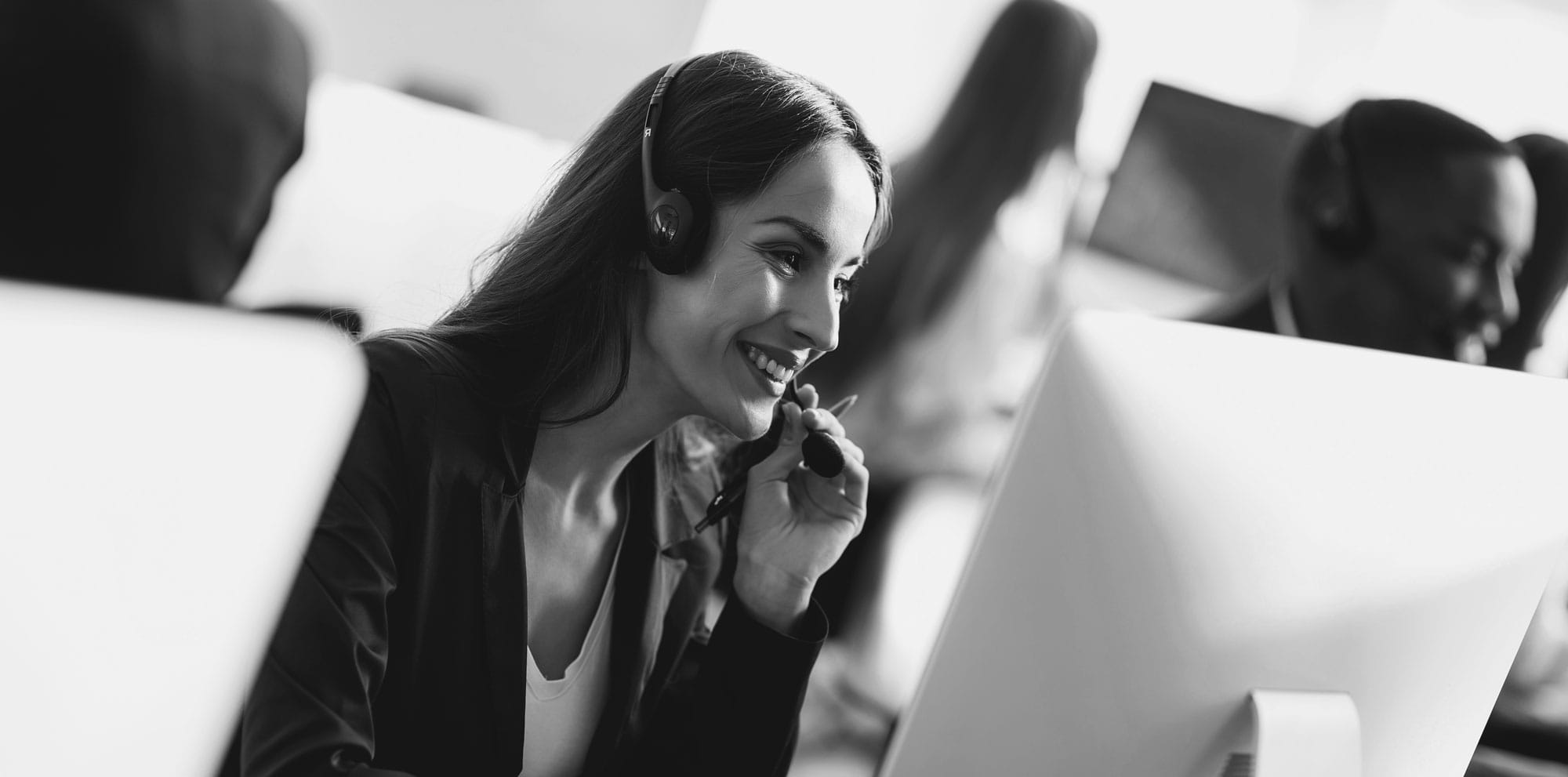 Woman with headset on in a call center